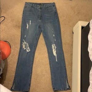 High rise, distressed, slit jeans. Medium wash